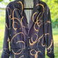 Unisex black jacket with bleached peach swirls.  Unisex. Size M.