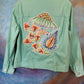 Mint green jean jacket, appliqued flowers.  Size L.