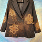 Black double-breasted blazer with bleached flowers.  Size L.