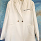 White blazer with wings.  Size L.